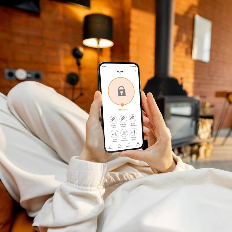 woman-using-phone-with-running-smart-home-security-application.jpg woman-using-phone-with-running-smart-home-security-application.jpg